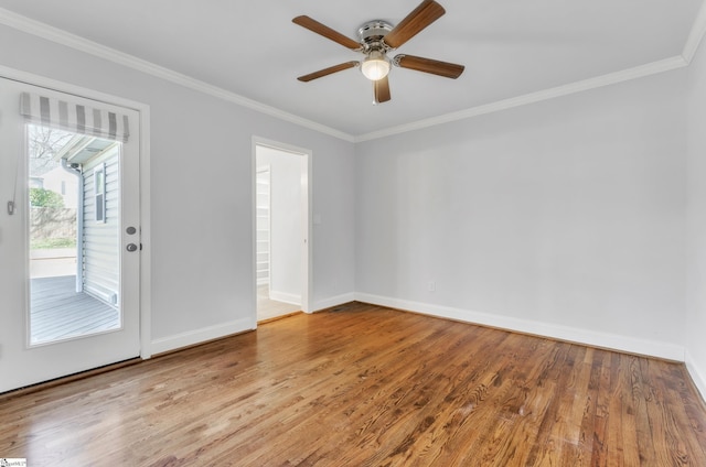 unfurnished room with ceiling fan, ornamental molding, and wood-type flooring