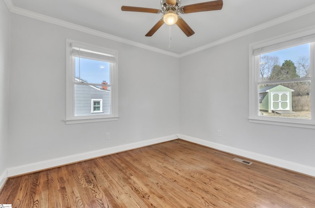 spare room with crown molding, ceiling fan, and light hardwood / wood-style flooring