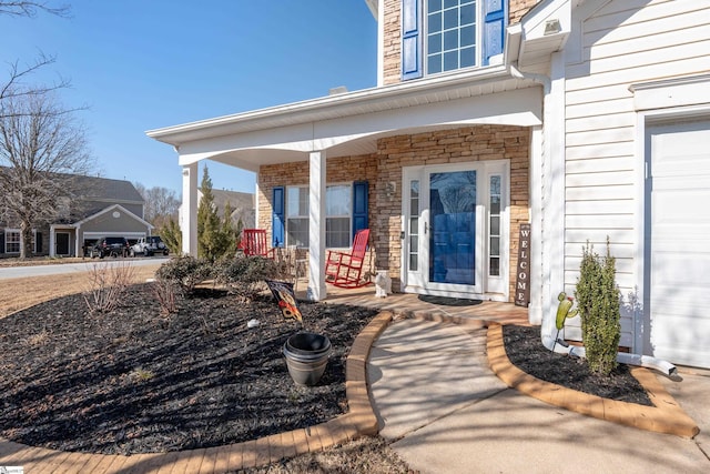 property entrance featuring a porch