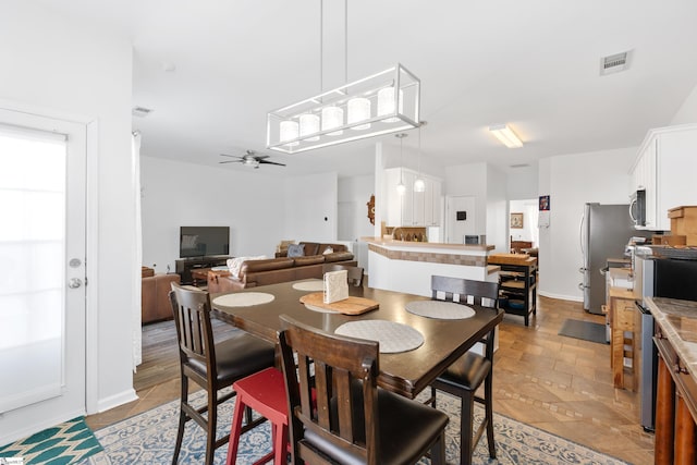 dining space with ceiling fan