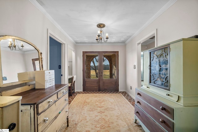 entryway featuring crown molding, a wealth of natural light, and a chandelier