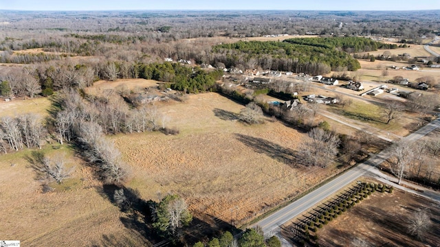 birds eye view of property featuring a rural view