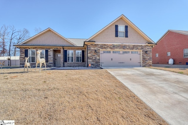 craftsman-style home featuring a garage and a front yard