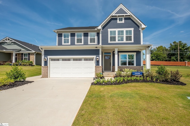 craftsman inspired home featuring a garage and a front yard