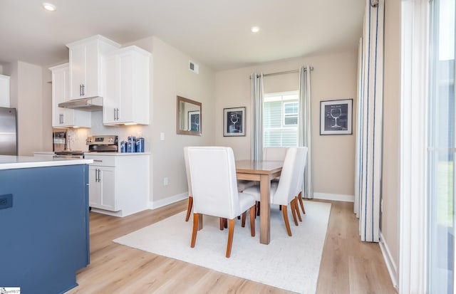 dining room with light hardwood / wood-style flooring