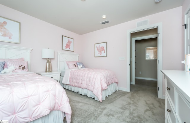 bedroom with light colored carpet