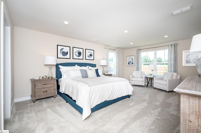 bedroom featuring light carpet