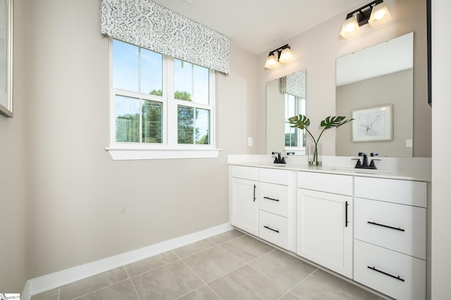 bathroom with tile patterned flooring and vanity