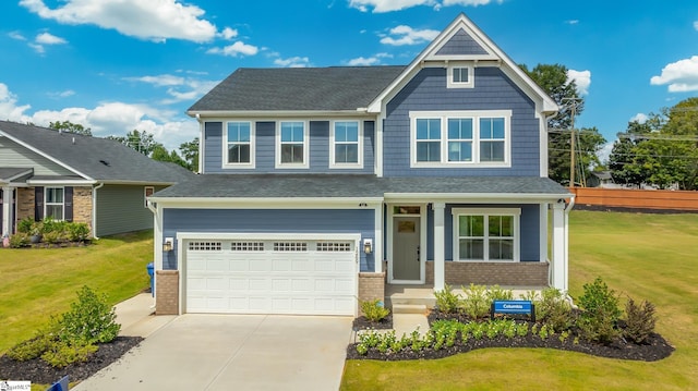 craftsman-style house featuring a garage and a front lawn