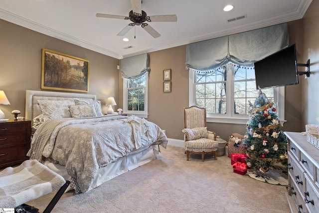 bedroom with ornamental molding, light colored carpet, and ceiling fan