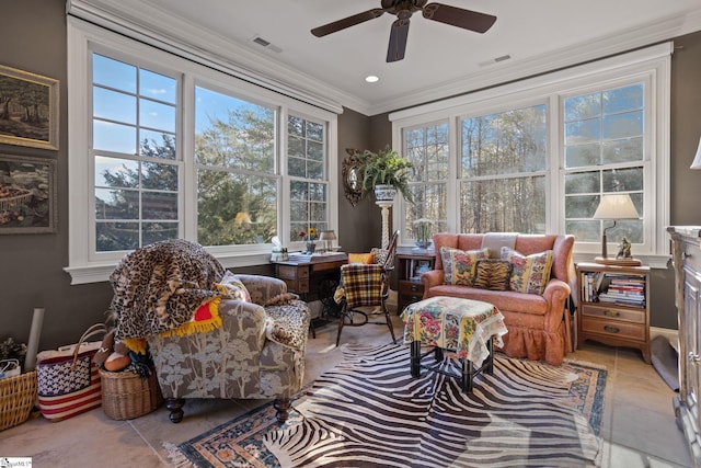 sunroom / solarium featuring ceiling fan