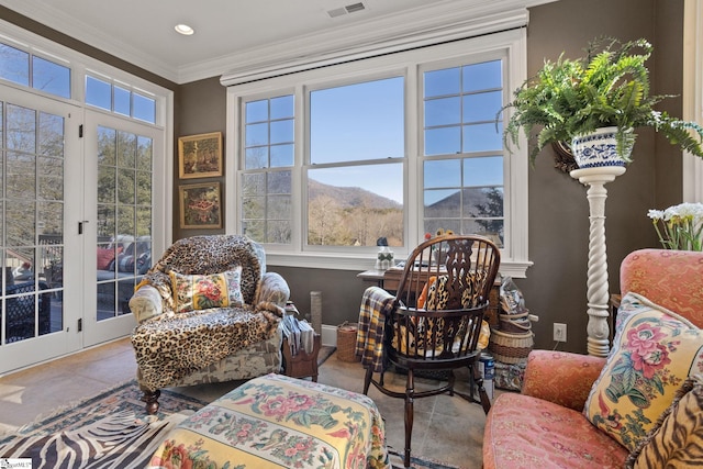 sunroom featuring a mountain view