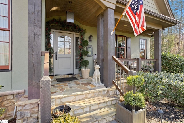 view of exterior entry with covered porch