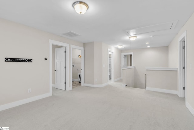 empty room with light colored carpet