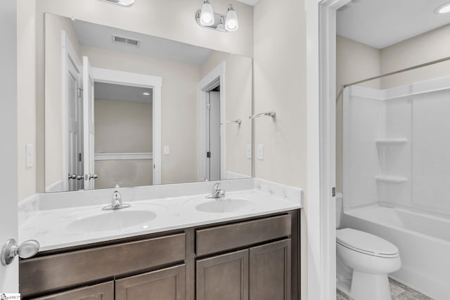 full bathroom featuring shower / bathing tub combination, vanity, and toilet