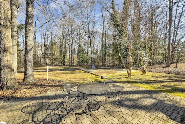 view of patio / terrace with basketball hoop