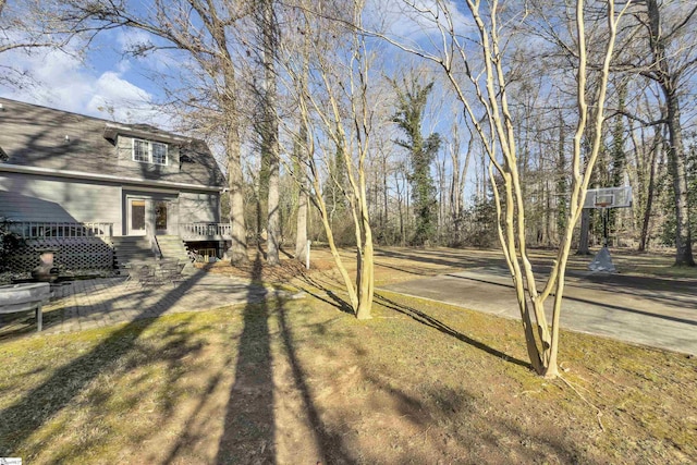 view of yard featuring a wooden deck