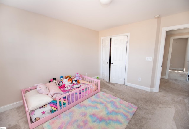 carpeted bedroom with a closet