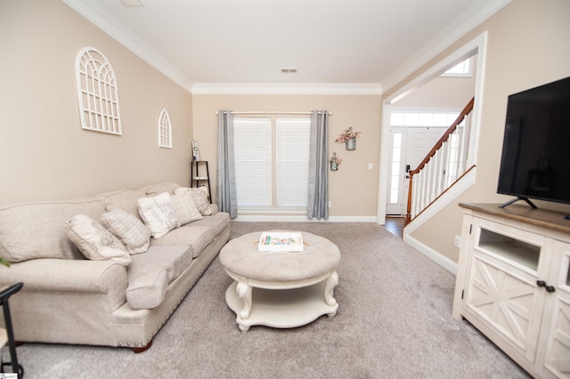 carpeted living room with ornamental molding