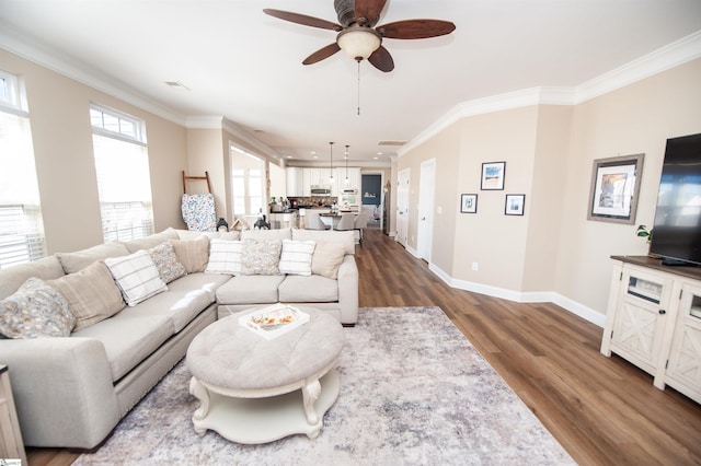 living room featuring crown molding, ceiling fan, and hardwood / wood-style floors