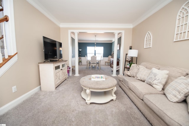 living room featuring decorative columns, crown molding, and light colored carpet