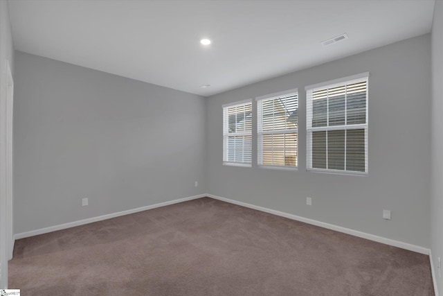 unfurnished room with carpet flooring