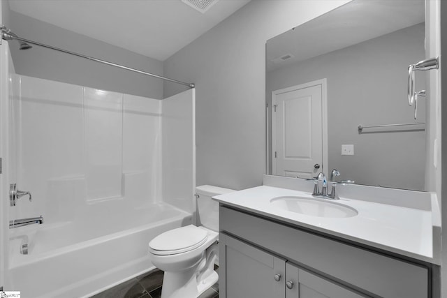 full bathroom with toilet, vanity, and shower / washtub combination