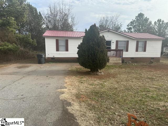 view of side of property with a yard