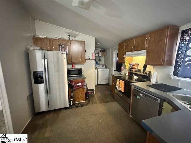 kitchen featuring washer / clothes dryer, stainless steel appliances, and sink