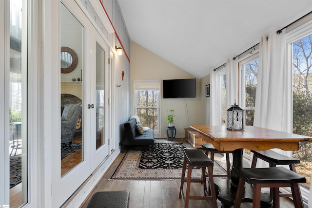 sunroom / solarium with lofted ceiling and plenty of natural light