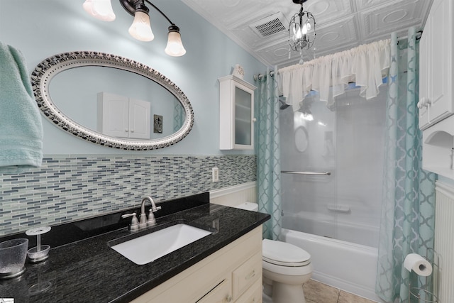 full bathroom featuring crown molding, shower / tub combo, tile patterned flooring, vanity, and toilet