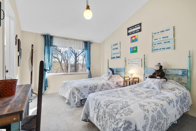 bedroom with lofted ceiling and carpet flooring