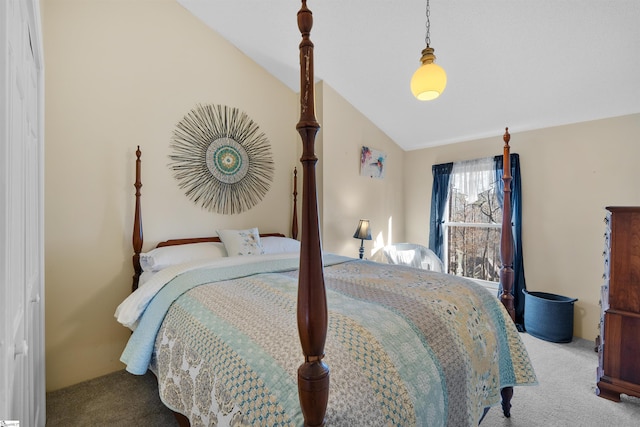 carpeted bedroom featuring lofted ceiling