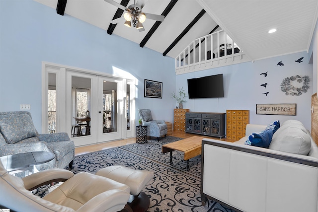 living room with beamed ceiling, hardwood / wood-style flooring, high vaulted ceiling, and french doors