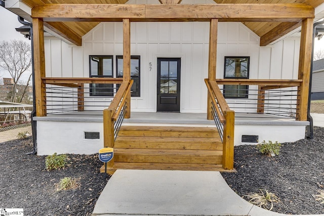 view of exterior entry featuring a porch