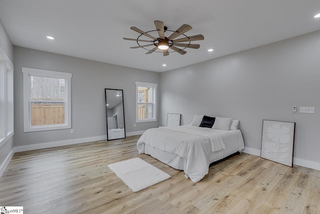 bedroom featuring light hardwood / wood-style flooring and ceiling fan