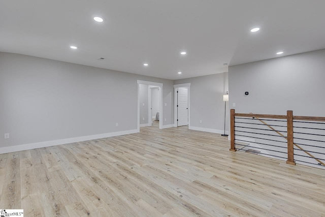 unfurnished room with light hardwood / wood-style floors