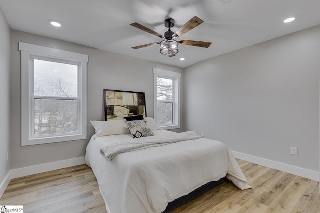 bedroom featuring ceiling fan and light wood-type flooring