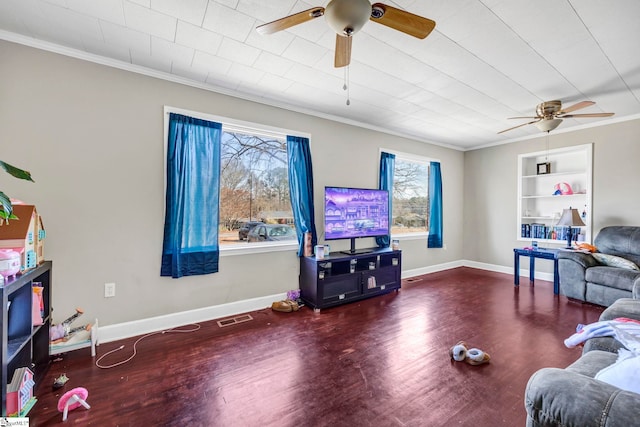 living room featuring ceiling fan, ornamental molding, wood-type flooring, and built in features