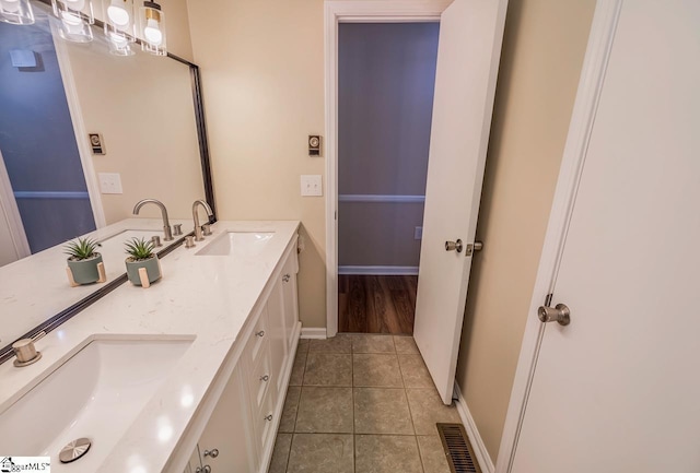 bathroom with vanity and tile patterned floors