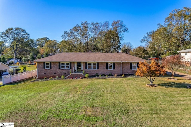 ranch-style home with a front yard