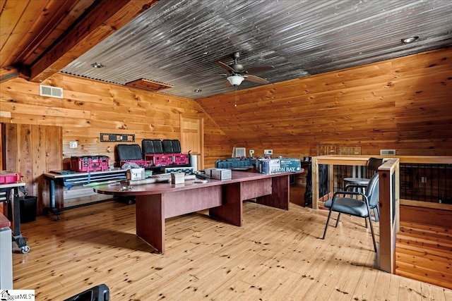 office space with vaulted ceiling, wood walls, ceiling fan, wooden ceiling, and light hardwood / wood-style flooring