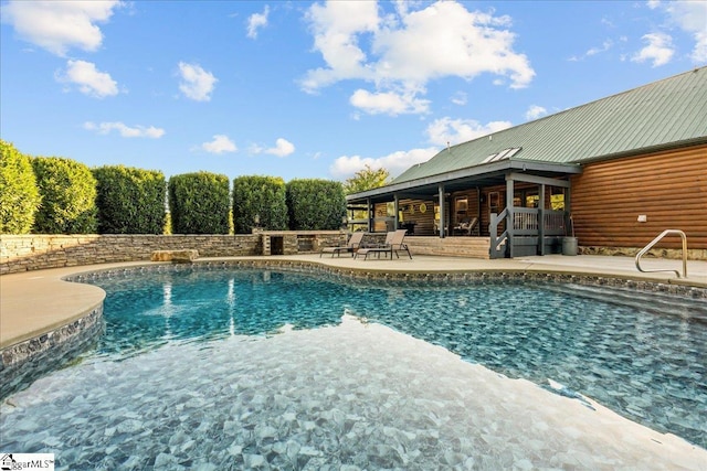 view of pool featuring a patio area