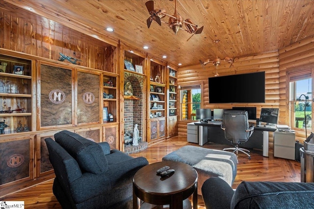 office area with hardwood / wood-style floors, wood ceiling, rustic walls, and ceiling fan