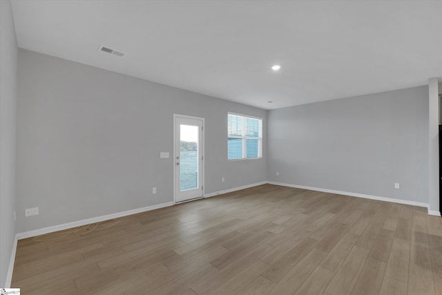 spare room with light wood-type flooring