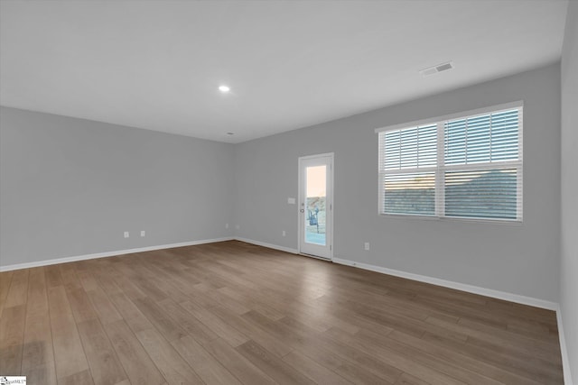 spare room featuring light hardwood / wood-style flooring