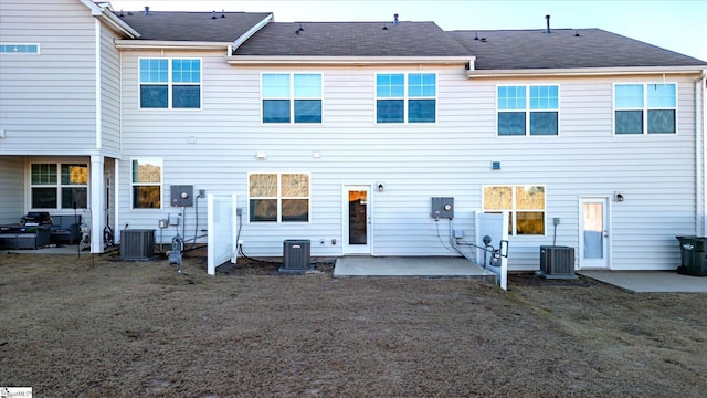 back of house featuring a patio area and central air condition unit