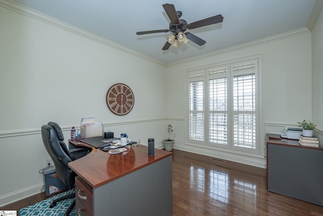 office area with dark wood-type flooring, ornamental molding, and ceiling fan