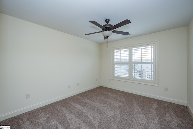 unfurnished room featuring ceiling fan and carpet