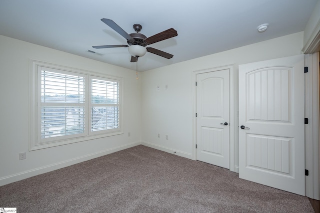 unfurnished bedroom with carpet floors and ceiling fan